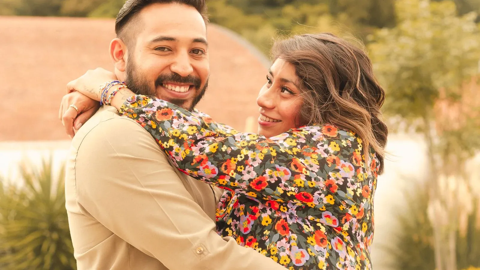 Happy couple embracing outdoors, renewing hope for parenthood through embryo donation in Cyprus