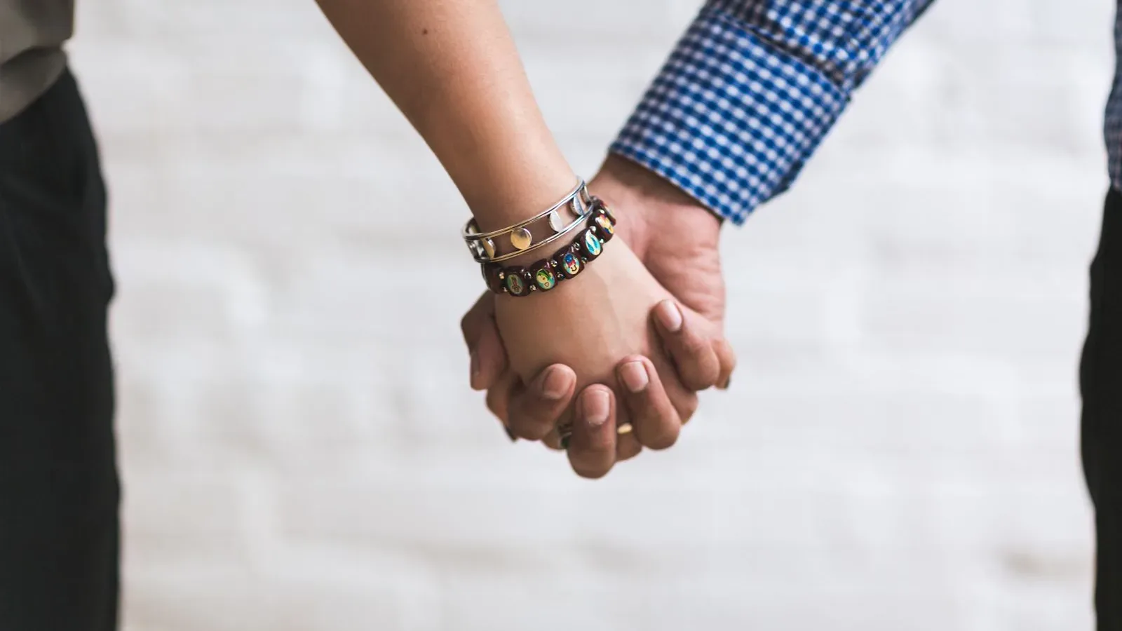 Couple holding hands, securing their reproductive future with embryo freezing in Cyprus